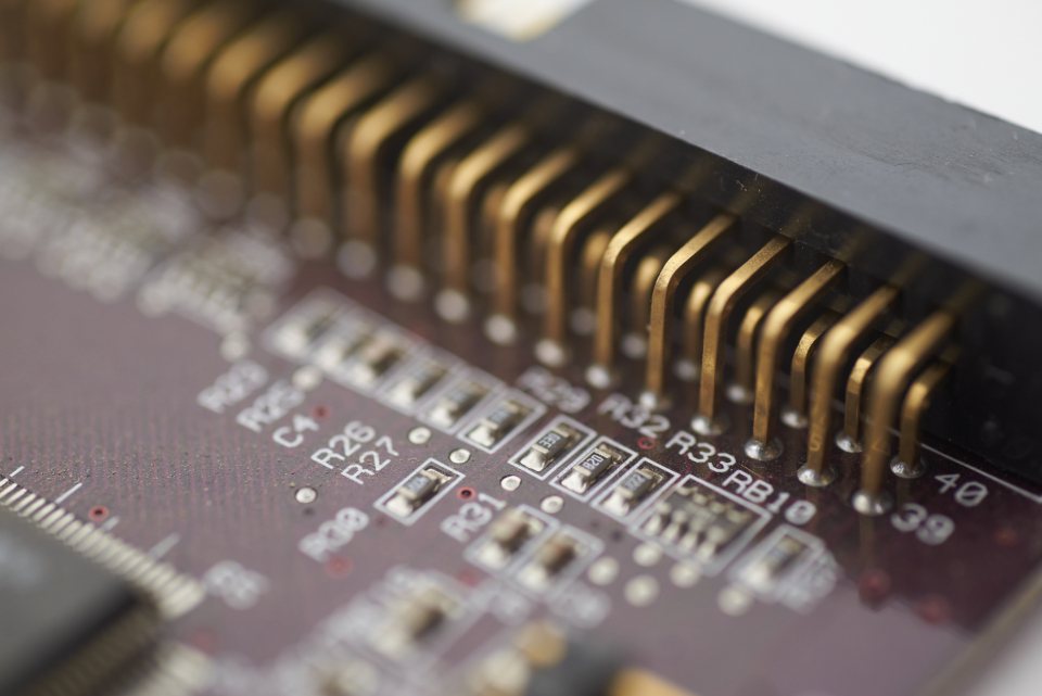 Close view of gold contacts and components on a circuit board